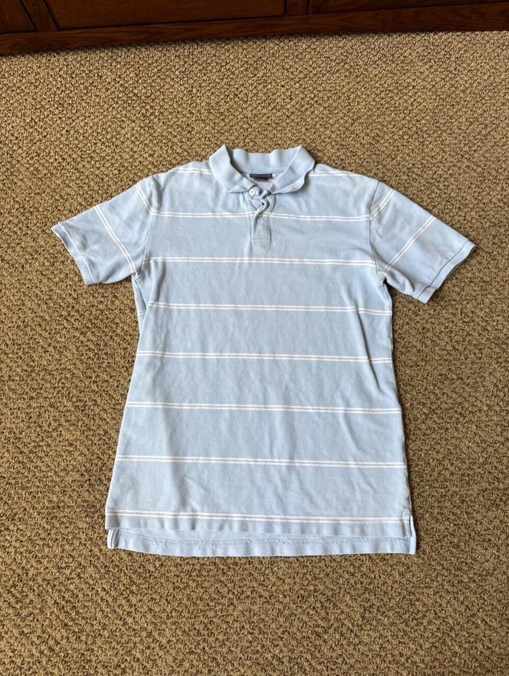 Cherokee light blue polo shirt with white horizontal stripes